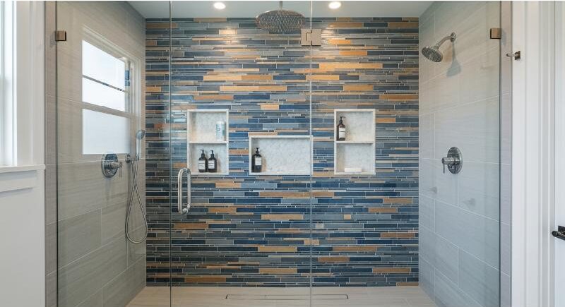 Custom frameless glass shower with tile accent wall and built-in niches in a Downtown Austin bathroom.